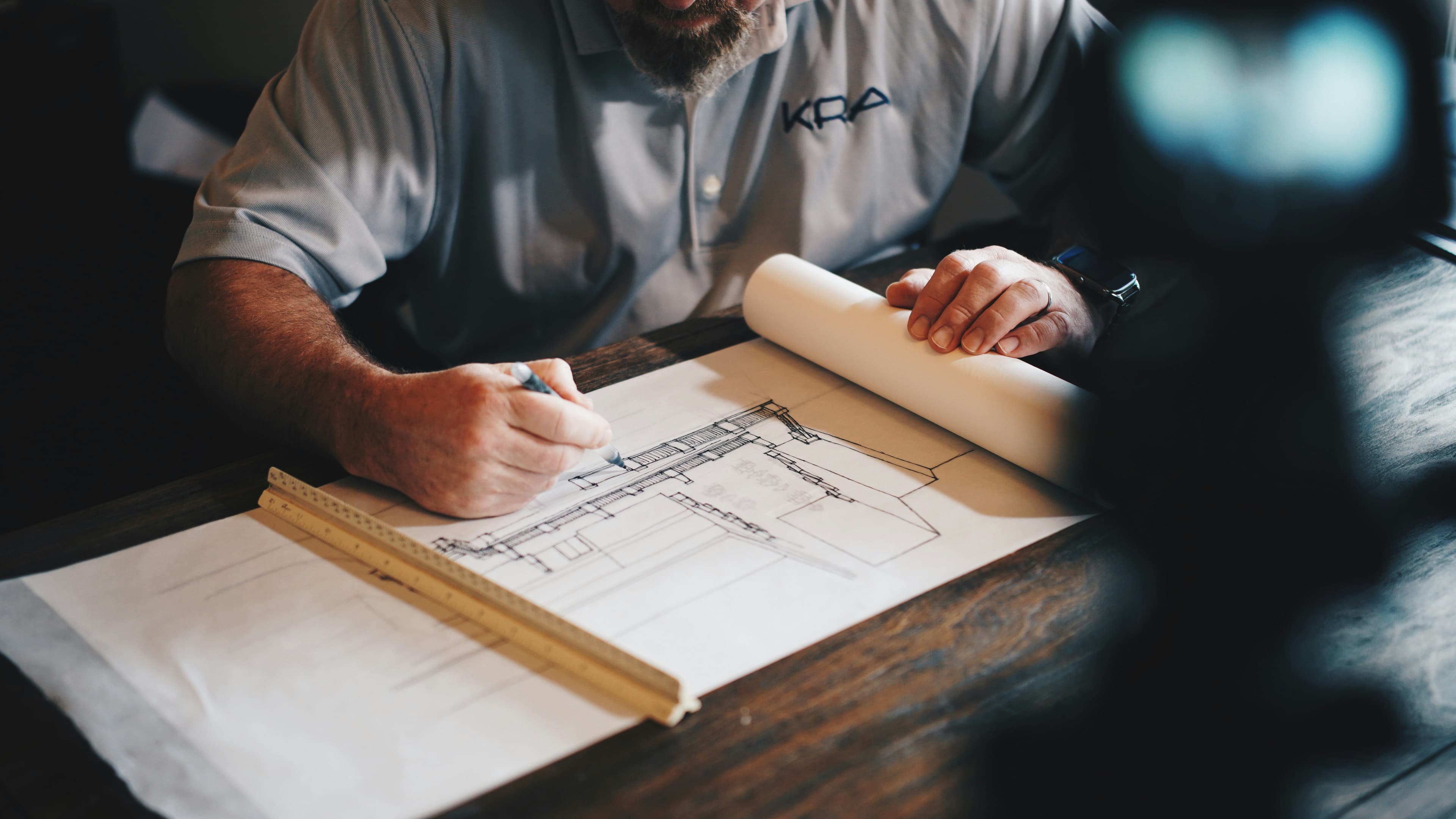 Builder reviewing construction plans